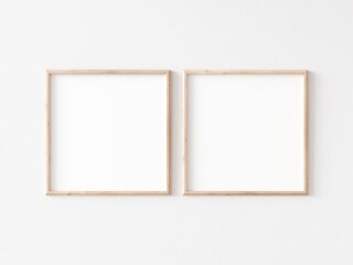 Obraz premium Two square thin wooden frame on white wall. 3d illustration.
