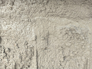 Wet rough concrete floor as texture background.