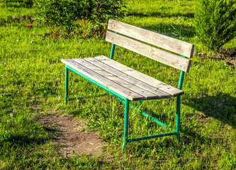 Lonely standing wooden bench on the nature close-up.