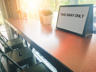 table and chairs in cafe restaurant with poster sign word 