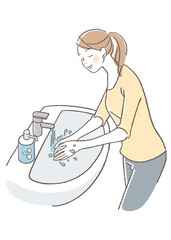 目をつむり手を洗う女性