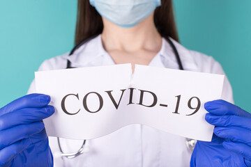 New coronavirus novel ncov overcome concept. Close-up cropped photo of professional doctor in white...