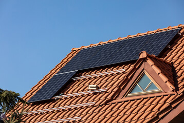 Solar electric panels on a house roof in  Ochojno. Poland