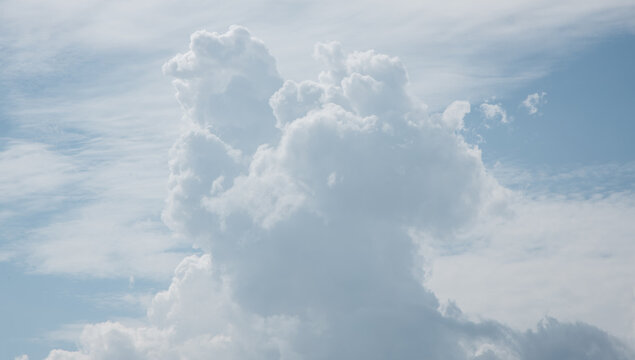 white fluffy clouds in the blue sky .blue sky background with tiny clouds © ooddysmile