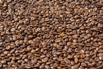 Coffee beans background close-up view from the top