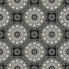 Floral mosaic tile ornament. Ethnic, tribal background. Ornamental seamless surface pattern. Repeated abstract flowers.