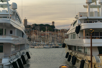 Luxury yachts harbor at golden hour view at Cannes Yacht Charter.
Cannes is one of the most famous resorts on the French Riviera and is home to a huge number of superyachts with its’ two large ports.