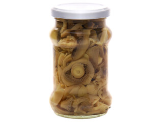 Canned mushrooms in a glass jar isolated on white background
