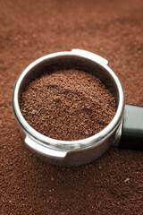 Metal scoop on coffee powder, closeup
