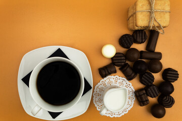 Obraz na płótnie Canvas Coffee with milk and chocolates
