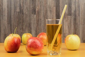 Useful apple juice in a glass background for text