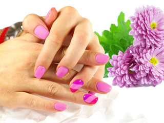 Fototapeta premium Beautiful purple manicure with flowers on white background 