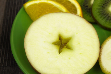 Sliced fruits and apple in the shape of a star
