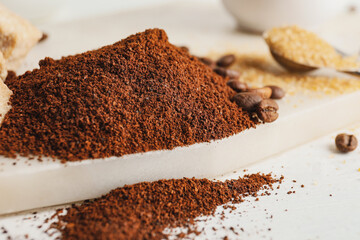 Heap of coffee powder on table, closeup
