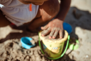 Sand castle and family at sea. Family beach vacation concept.