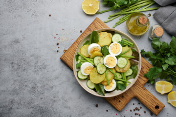 Asparagus salad with potatoes, lettuce and eggs. Fresh appetizer for healthy diet