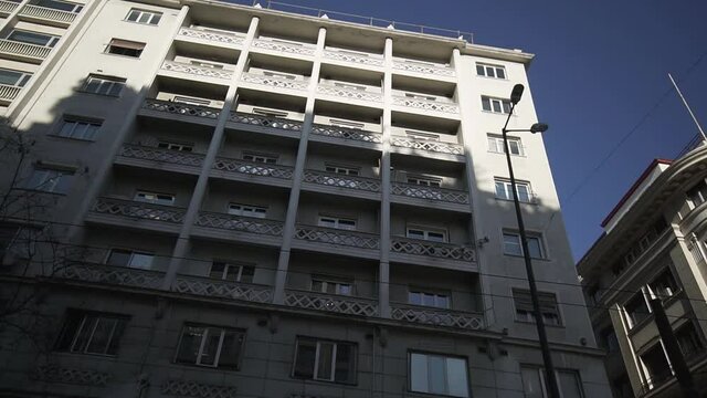 greek exterior architecture , top of buildings Athens urban lifestyle  , ride with the car in city centre smooth cinematic movement of camera