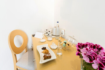 Guest welcome sweets and drink in hotel room