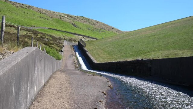 Low angle view of Greenfield reservoir dam overflow channel or spillway.