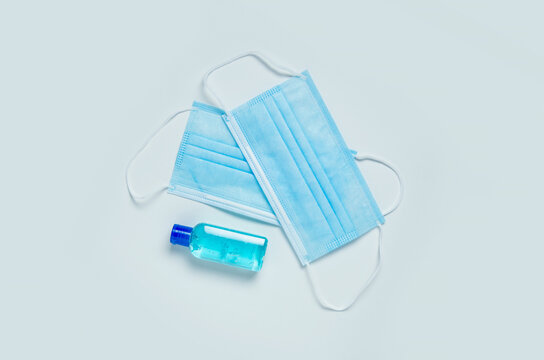 
Medical masks and antibacterial gel on a white background
