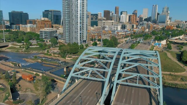 Aerial: South Platte River, Speer blvd bridge & downtown Denver, Colorado, USA