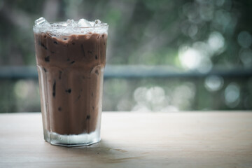 Iced mocha coffee in glass put on wooden