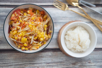 Somtum corn salad served with sticky rice