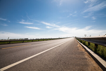 Picturesque country road and clear sky - 354831647