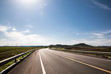 Picturesque country road and clear sky - 354831829