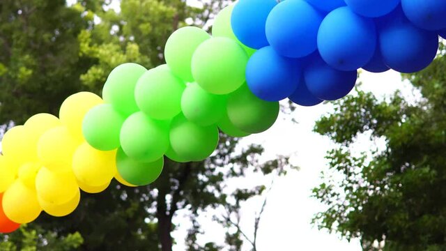 Rainbow color balloons in LGTBQ event, gender equality social gathering, panning