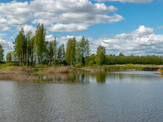 calm scene of beautiful sky with cumulus clouds reflection on the lake
