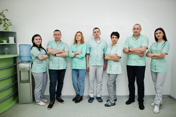 Medical theme. Portrait of the group of doctors at reception of diagnostic center in hospital.