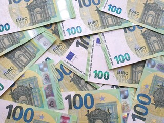 Fototapeta na wymiar Background of 100 Euro banknotes. Euro bill close up