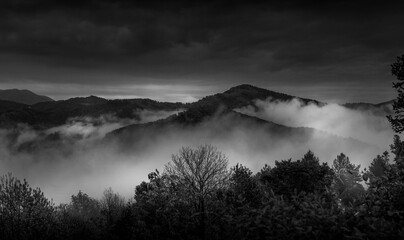 Black and white mountain landscape in cloudy day
