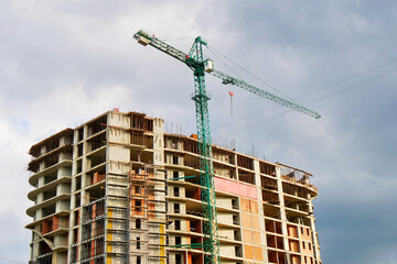 Fototapeta na wymiar Construction site. Building site with crane. Concrete building under construction