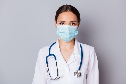 Photo of attractive virologist doc lady experienced skilled professional listen patient wear facial cotton mask medical uniform lab coat stethoscope isolated grey background