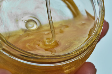 Beauty portrait of red head woman with gold mask on face. Skincare cleansing eco organic cosmetic