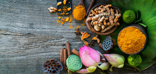 Turmeric powder,Turmeric fresh and ingredient herbs on wooden background