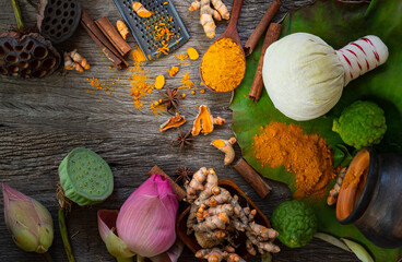 Turmeric powder,Turmeric fresh and ingredient herbs on wooden background