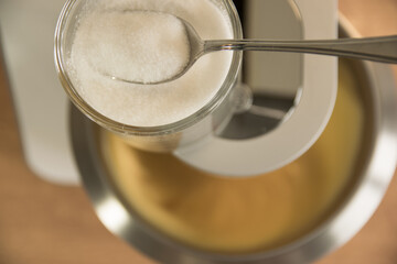 Metal dough with biscuit and electric mixer.
