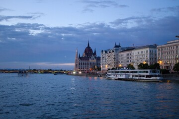 Landscape view of Hungarian Parliament Building (Országház) on the Danube during sundown