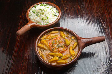 Ocra Lebanese typical food on wooden background.