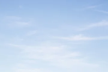Foto auf Acrylglas Blurred nature background of sky with clouds. Blue sky with clouds background with soft focus. Empty sky background for your design. © Struzhkova Ilona