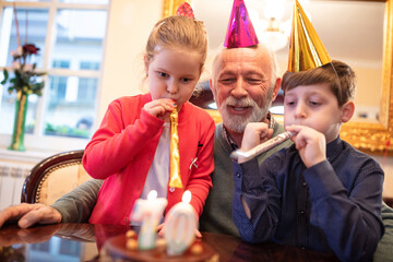 Grandfather having a party with his grandchildren