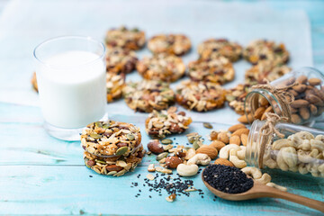 Multigrain Cookies and vegetarian ingredient with milk on blue wooden table