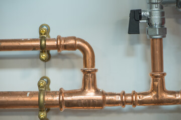 Copper pipework with isolator valve. Close up view.