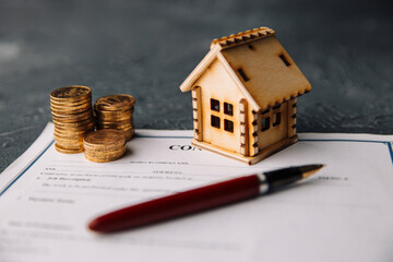 House model with real estate agent and customer discussing for contract to buy house, insurance or...
