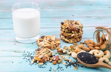Multigrain Cookies and vegetarian ingredient with milk on blue wooden table