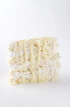 Vertical image.Piece of dlicious biscuit cake with condensed milk topping