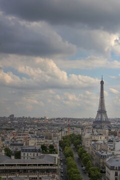 Beautiful, dark, calm photo of the Eiffel Tower taken at sunset from the Arc de Triomphe